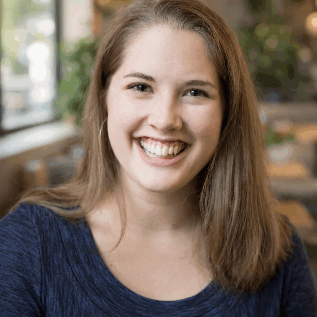 Smiling Photo of Laura Eaton, Mental Health Therapist, Accepts Insurance, Smiling woman with blue sweater