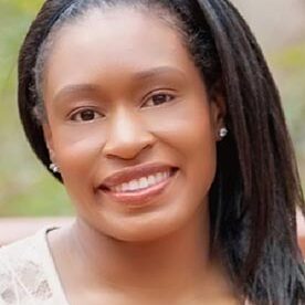Tykesia Hathorne smiling in an outdoor setting.